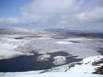 Highland snow scene - lochens on high ground